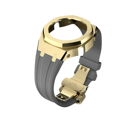 Bracelet de montre avec une lunette dorée octogonale et un bracelet en silicone gris clair, équipé d'une boucle déployante dorée pour un look élégant et contemporain.