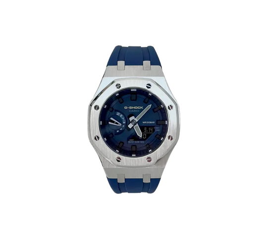 Montre Casio G-Shock avec un boîtier en acier inoxydable et un bracelet bleu, cadran bleu avec affichage analogique et numérique.