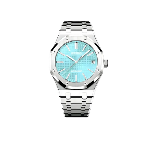 Montre Seiko automatique avec cadran turquoise texturé, index et aiguilles argentés, boîtier octogonal et bracelet en acier inoxydable. Un design lumineux et élégant pour un style unique.