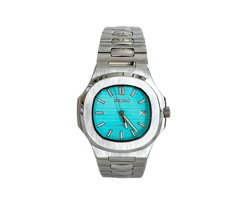 Montre automatique Seiko avec un cadran turquoise vif, boîtier en acier inoxydable brossé et bracelet assorti, affichage de la date.